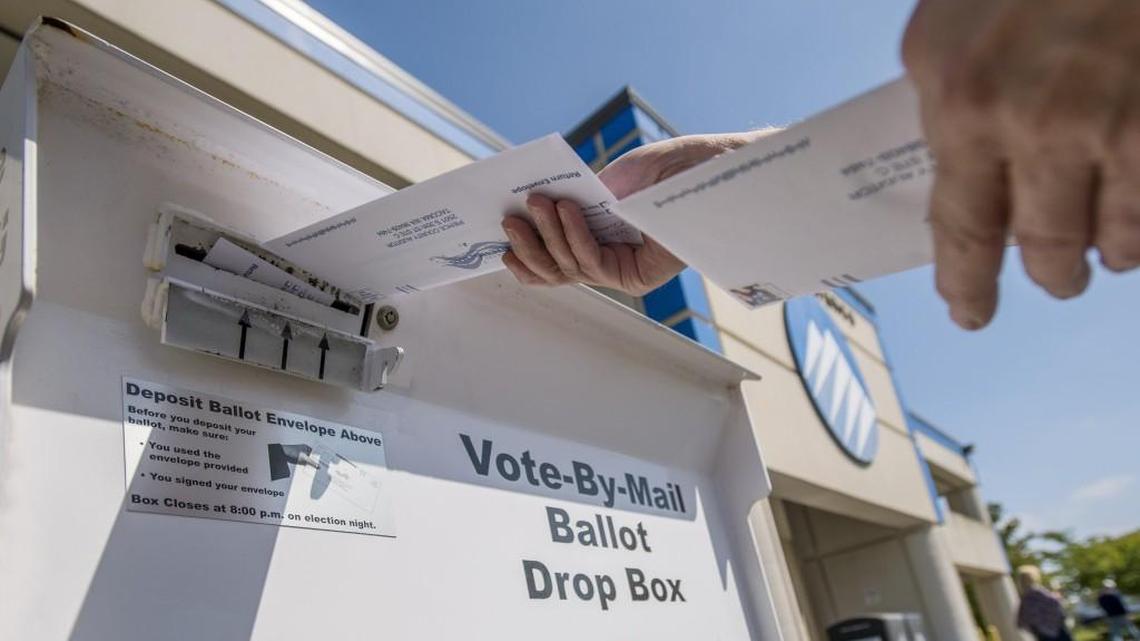 A voter deposits election ballots in the drop box at the Pierce County Annex, August 1, 2016. Late last month the Pierce County Auditor’s office announced plans to put one of five new ballot boxes to be placed throughout the county this year in Tillicum.