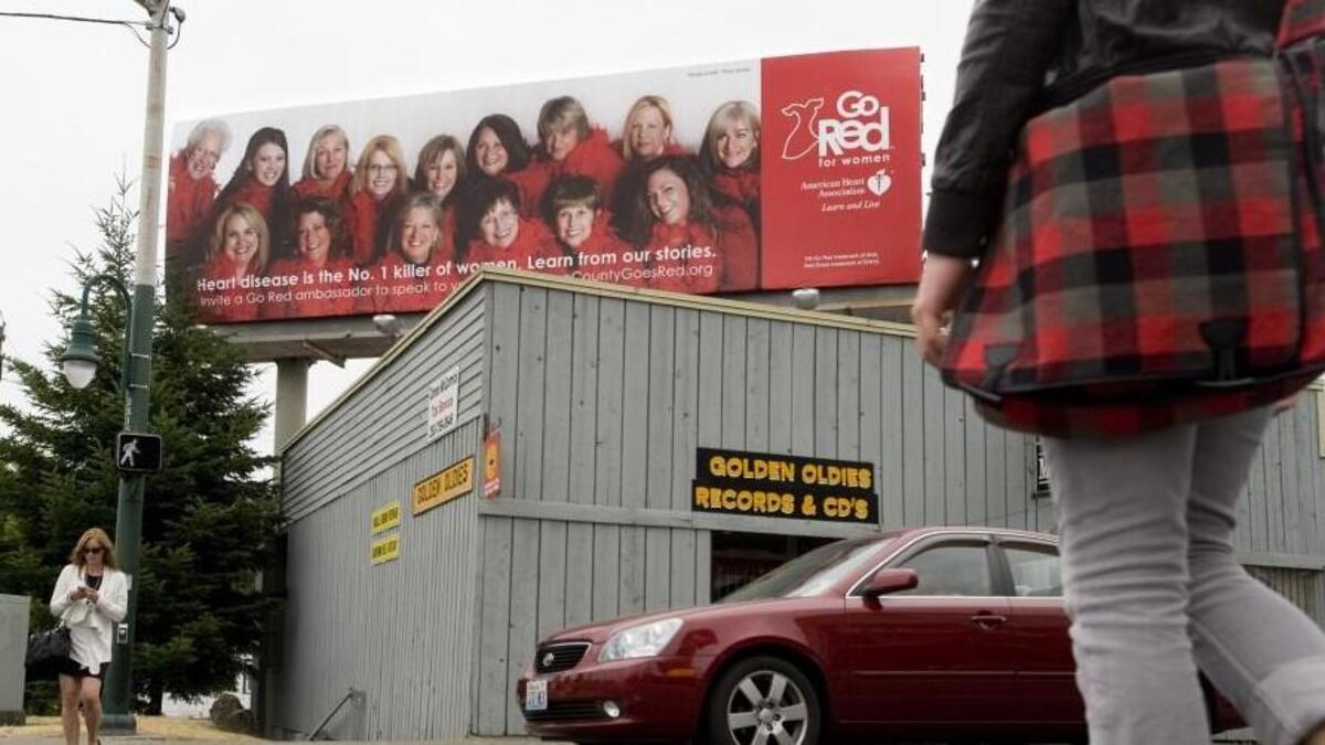 In this 2011 photo, a large billboard hovers over the northeast corner of Sixth Avenue and Union Street in Tacoma. The city’s long, legal fight over the fate of nearly 300 billboards seems about to end in a way that leaves News Tribune columnist Matt Driscoll saying, “Meh.”