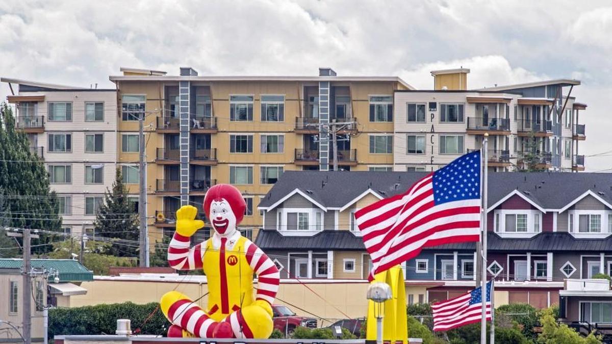 
Some of the newest housing, The Pacifica and Pine Crest Town Homes near the Tacoma Mall, are visible over Ronald McDonald on the commercial strip along South 38th street. August 28, 2015
