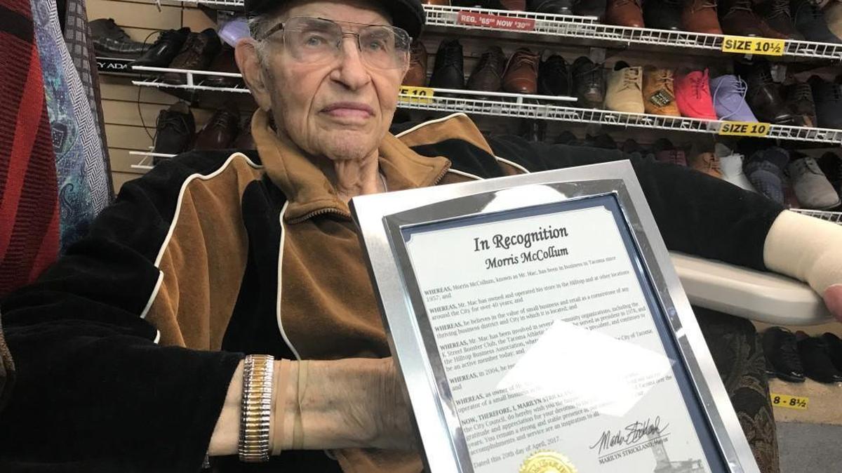 Morris McCollum, better known as Mr. Mac, poses with the proclamation he received from the Tacoma City Council in honor of his 90th birthday.