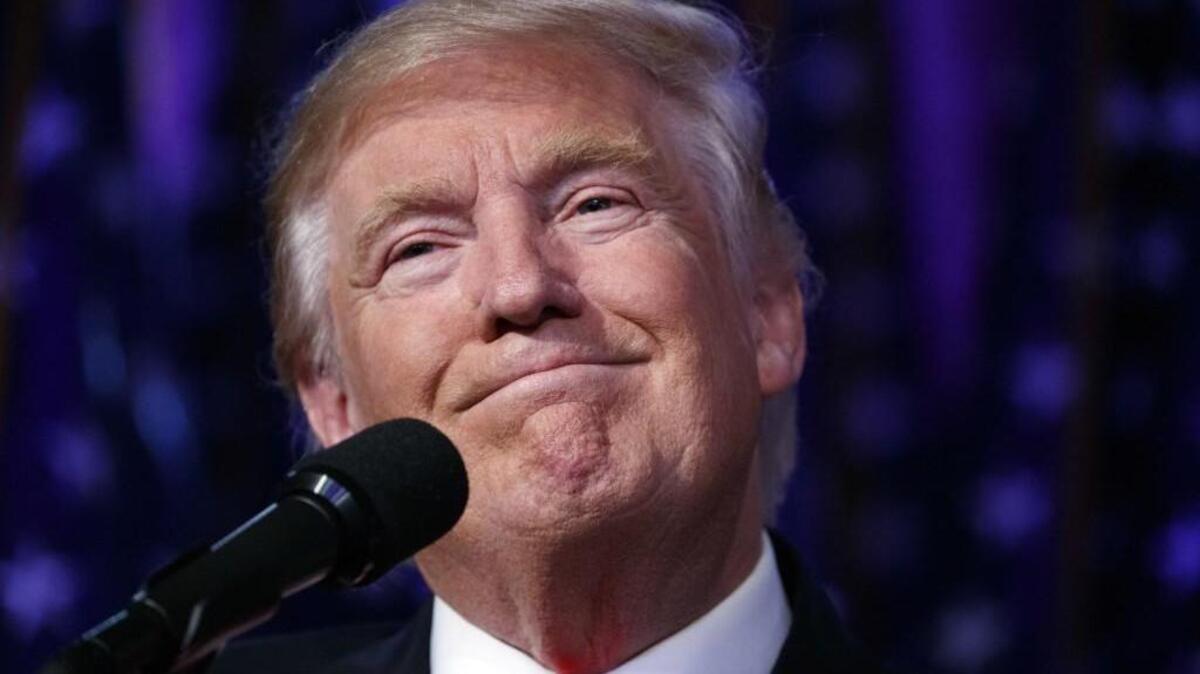 U.S. President-elect Donald Trump smiles as he arrives to speak at an election night rally, early Wednesday, Nov. 9, 2016, in New York.