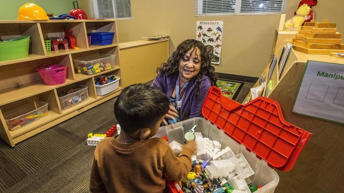 Cassandra Jackson, a preschool specialist, plays with a child at the new preschool at Tacoma Rescue Mission's Adams Street Family Shelter Friday, Dec. 22, 2017. A small, $1,500 grant through South Sound Together/Tacoma Children's Museum has made it possible for the Adams Street Shelter to open a preschool serving the children of people experiencing homelessness. Jackson said they are teaching the children how to trust their environment and others.