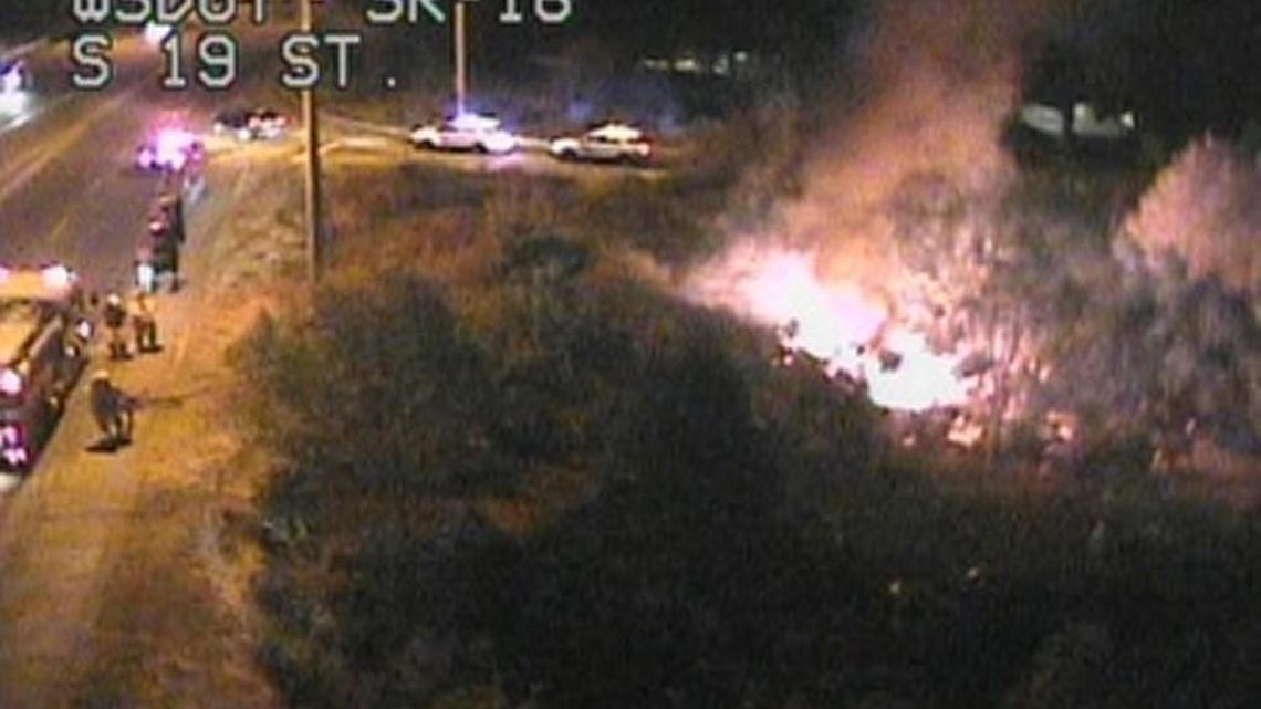 A small brush fire burns Thursday night along state Route 16 near the 19th Street exit in Tacoma. Crews were able to extinguish it within a few minutes, Washington State Patrol spokeswoman Brooke Bova said.