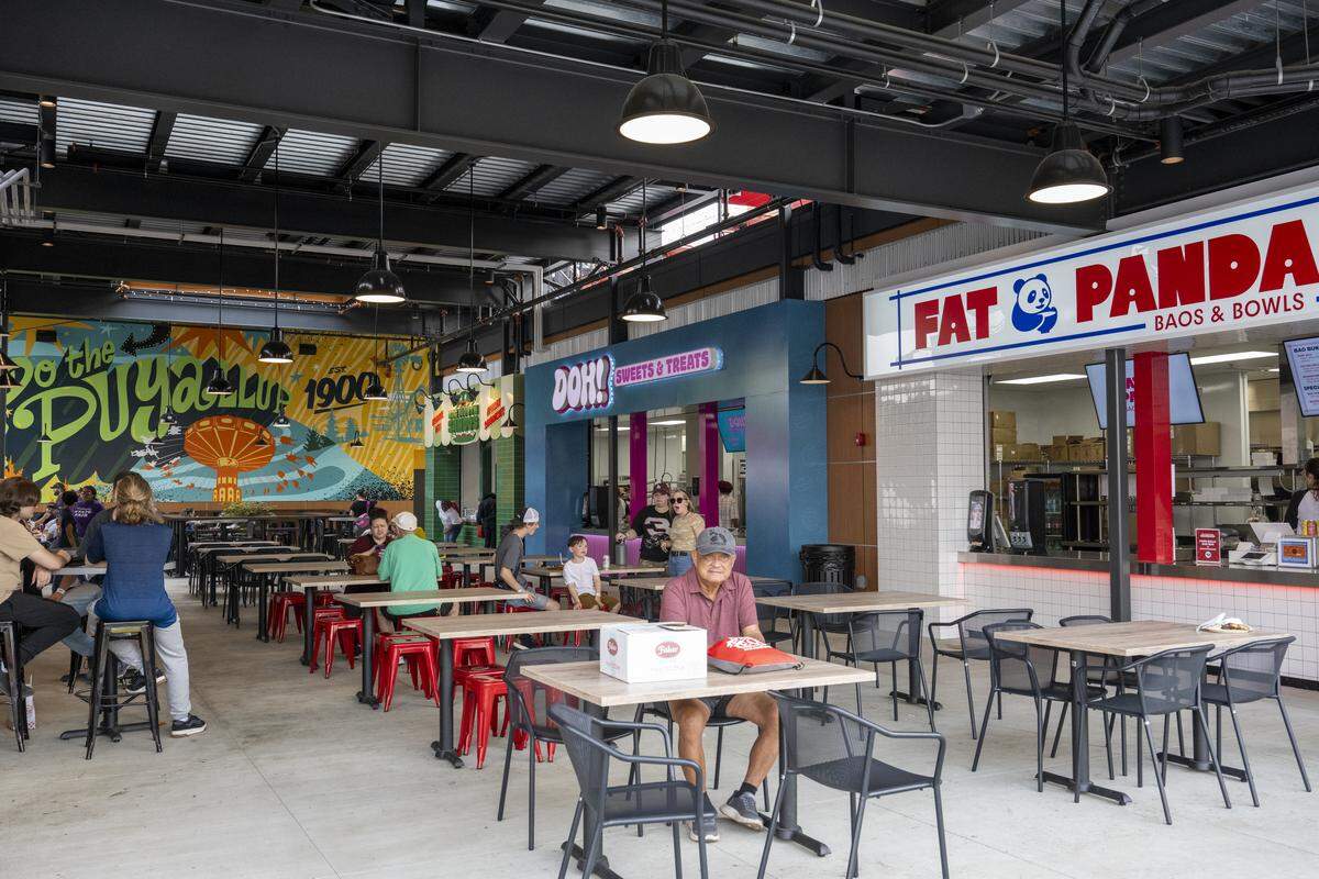 People sit on the lower level of the new 1900 Food Hall &amp; Rooftop Bar on Thursday, Sept. 4, 2025, at the Washington State Fair Event Center in Puyallup, Wash.