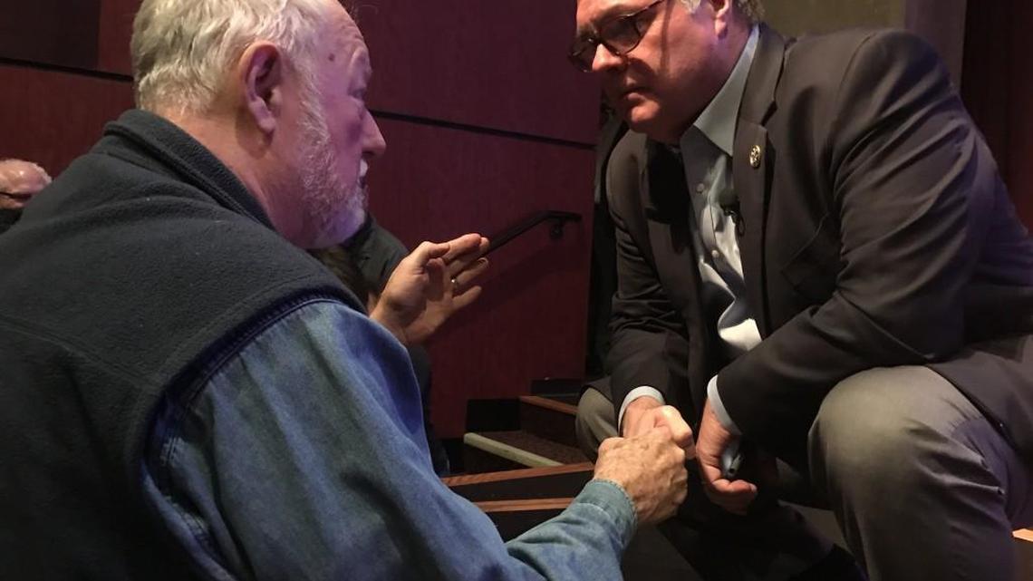 Congressman Denny Heck (D-Olympia) shakes hands with Tom Rainey, left, during a town hall Tuesday at South Puget Sound Community College. Heck fielded questions from the audience on a range of topics including the federal budget and health care.