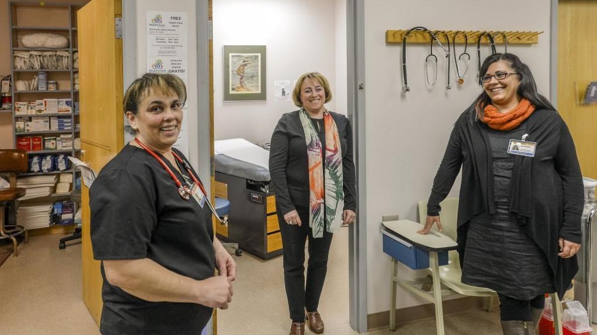 Jo Clarivel, from left, Eleanora Paley-Shwav, and Giovanna Urdangarain are all immigrants who work at Neighborhood Clinic, which provides free health care in Tacoma.
