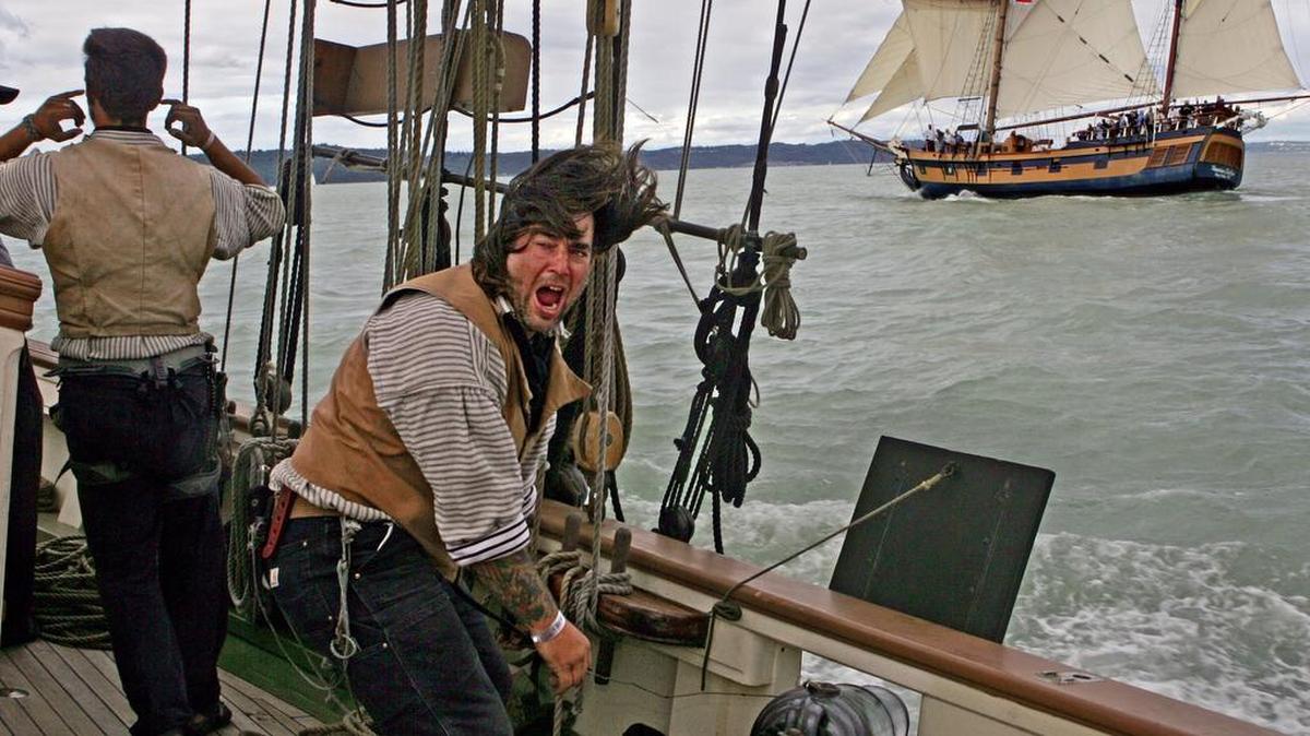 Billy Gernertt, gunner’s mate for the tall ship Lynx, yells, “Live free or die!” before firing a dummy charge from its cannon toward the Hawaiian Chieftan during a mock battle on Commencement Bay on July 4, 2008. The top-sail schooner was built to replicate a privateer or naval schooner from the War of 1812. The original Lynx was among the first ships to defend American freedom.