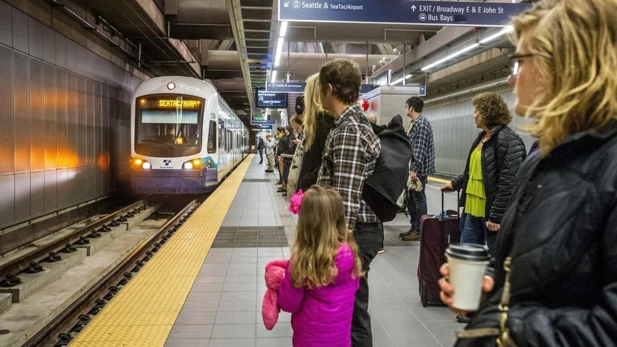 Commuters catch Sound Transit’s light rail trains in March at the Capitol Hill station in Seattle. Sound Transit’s cost for its first corridor, Sea-Tac Airport to the U District, will wind up 86 percent higher than the 1996 initial estimates, according to a new Seattle Times analysis.