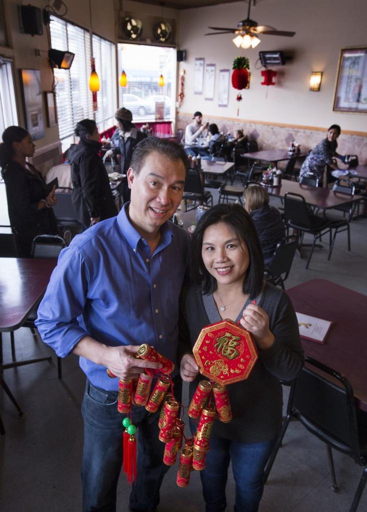 Vien Dong owners Kevin Le and Thuy-Linh Nguyen show off their Lunar New Year celebrations at their restaurant in Tacoma’s Lincoln International District in 2016.