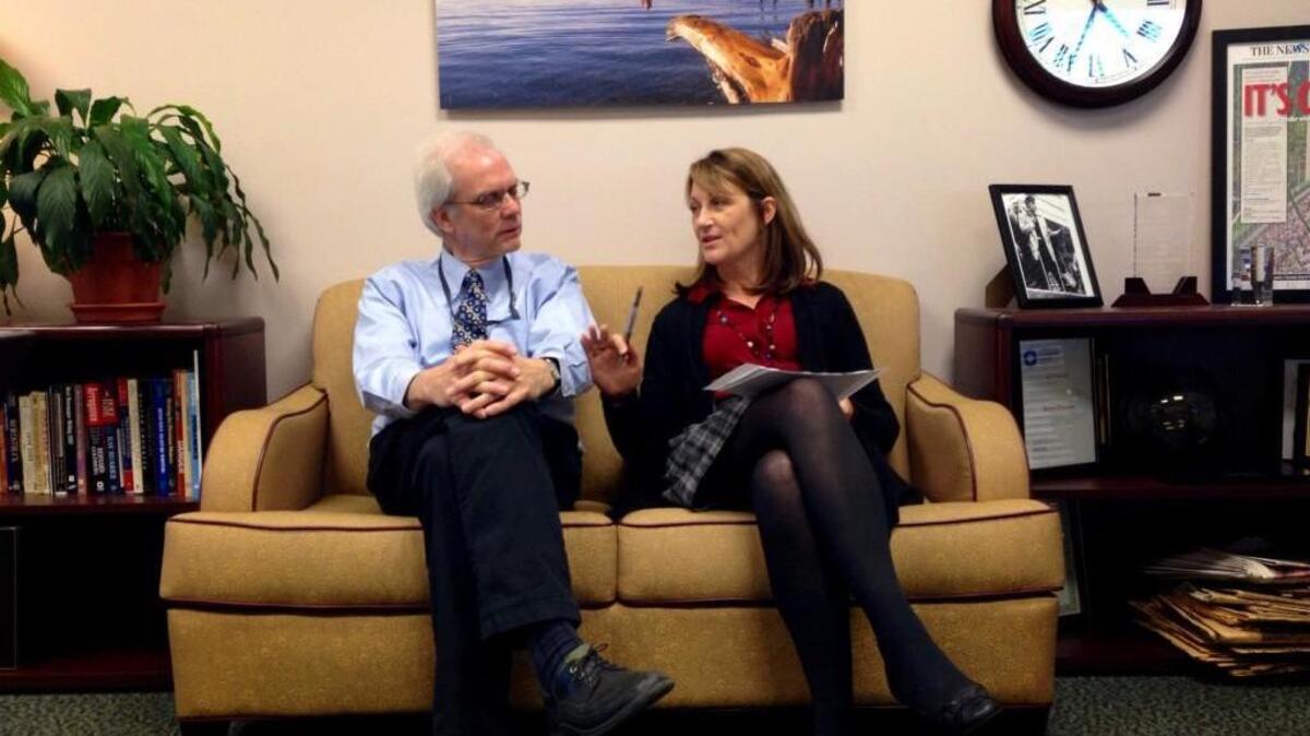 Randy McCarthy and Karen Peterson discuss an edit on a story about a same-sex wedding at the Special Commitment Center on McNeil Island during a meeting in Peterson’s office on Oct. 28, 2013.