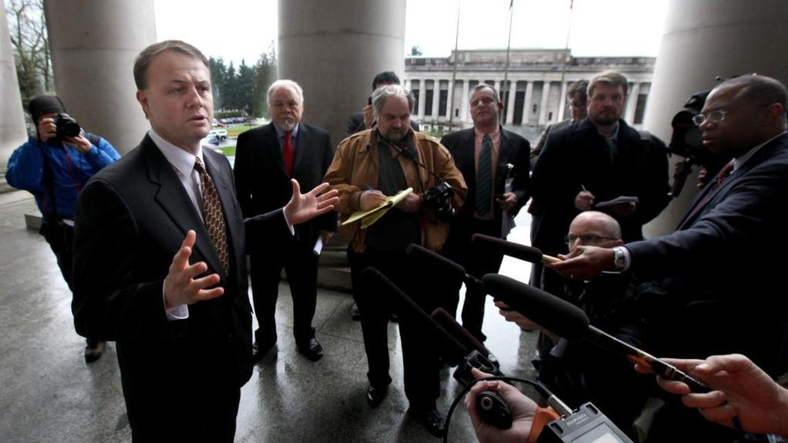 Tim Eyman (left) is seen here outside the state Capitol in 2013. On Thursday, he proposed an initiative to make members of the Washington Legislature subject to the Public Records Act.