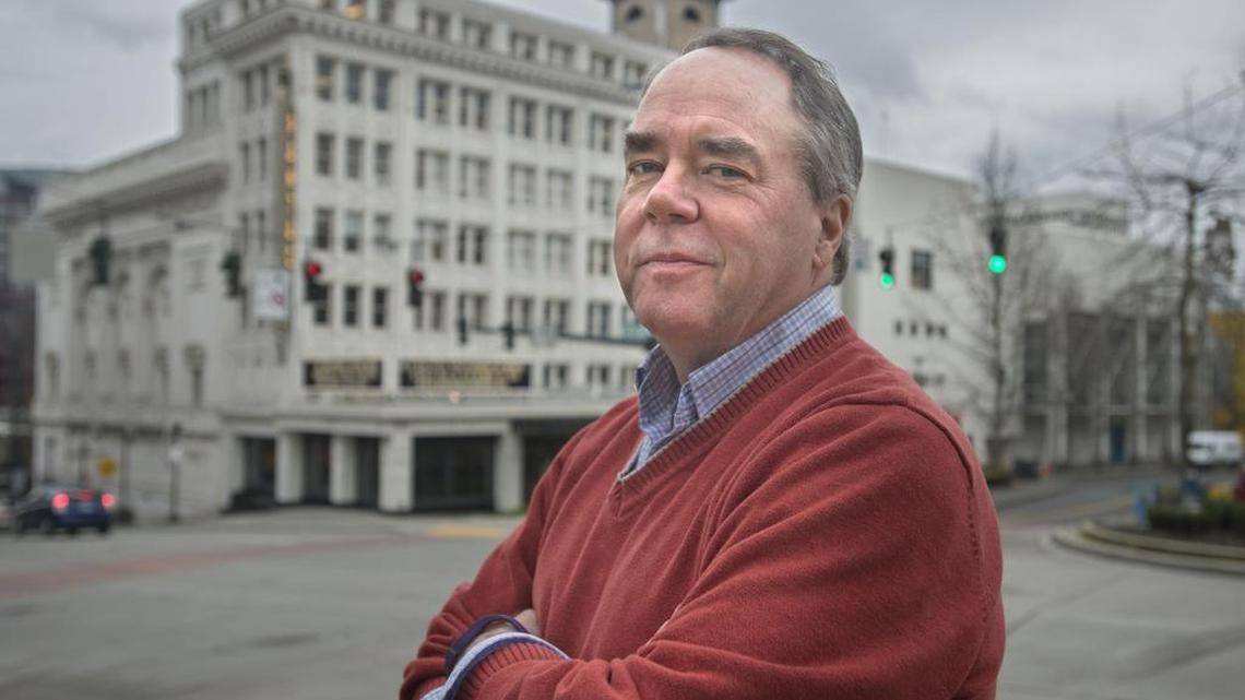 Broadway Center CEO David Fisher with Pantages Theater in the background in downtown Tacoma in February.