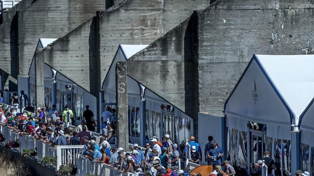 Fans enjoy the action from suites built into the remnants of the sorting bins of what used to be a sand and gravel mine on June 21, the fourth day of the 115th U.S. Open at Chambers Bay. Big sales of corporate suites helped the county make about $1.1 million on the tournament.