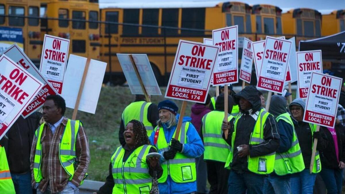 Seattle school-bus drivers picket at a First Student lot in South Seattle. The drivers went on strike Wednesday after contract talks with First Student, which provides bus service for Seattle schools, failed.