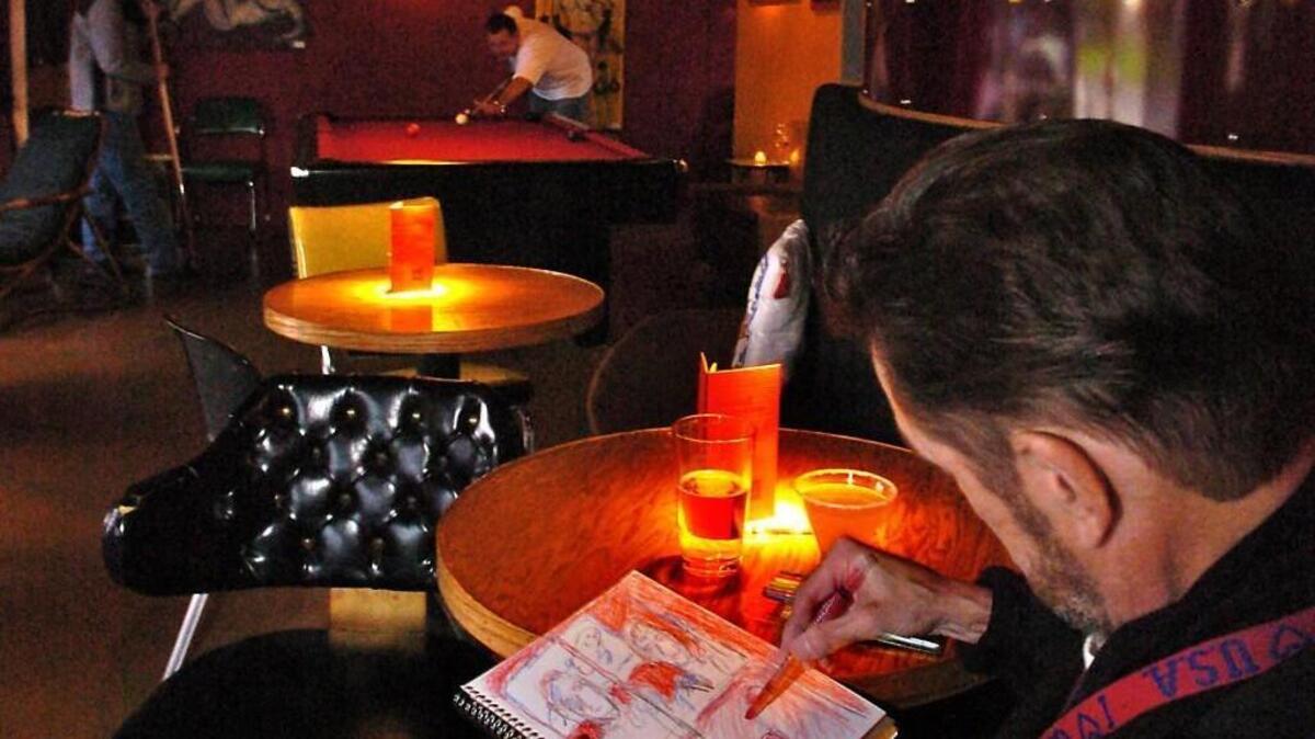 Teddy Haggarty sketching a scene inside a downtown Tacoma bar in 2006.