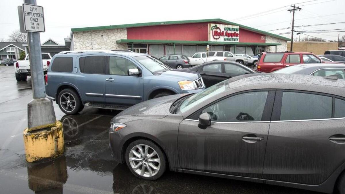 The city of Sumner currently uses the Red Apple market lot for employee parking. More ambitious plans to repurpose the prime downtown site at 822 Alder Ave. might succeed if rules were changed, the city has been told.