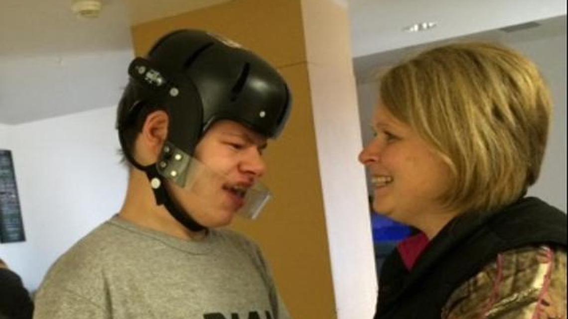 Joe McDermond with his foster mother, Kim Carlson.