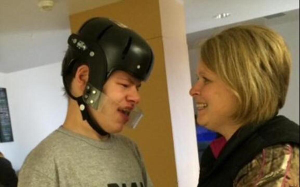 Joe McDermond with his foster mother, Kim Carlson.