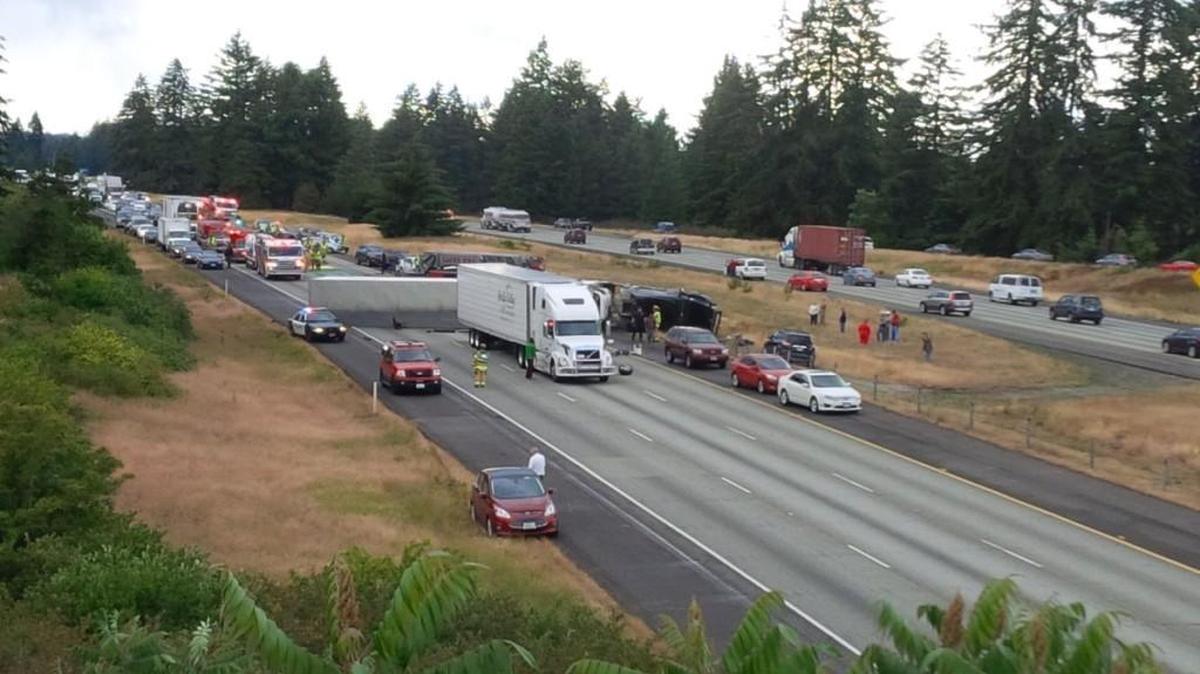 A rolled-over tractor-trailer rig blocks all lanes of Interstate 5 in Lacey on Tuesday night.