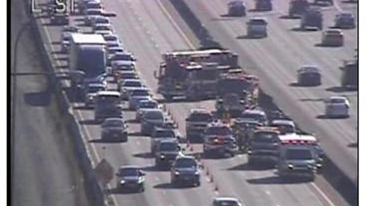 A minor-injury collision on northbound I-5 near the Tacoma is snarling traffic and blocking the two left lanes, extending the Friday rush hour.