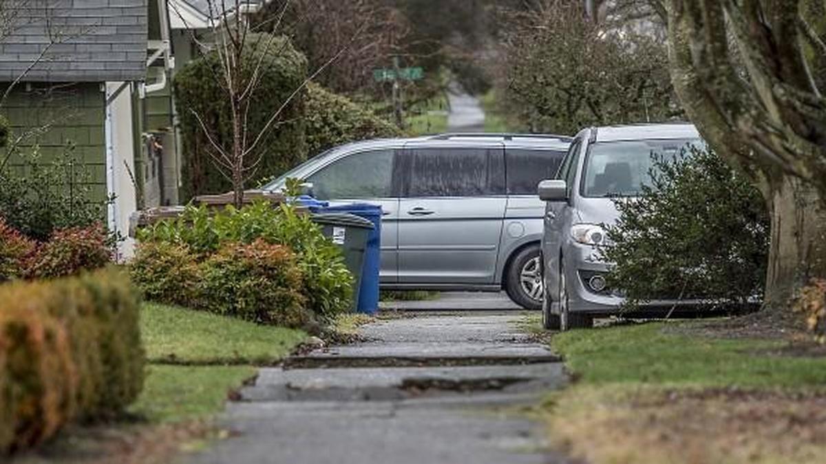A van blocks the sidewalk near the intersection of North Mason Avenue and North 30th Street in Tacoma on Friday, Jan. 12, 2018.