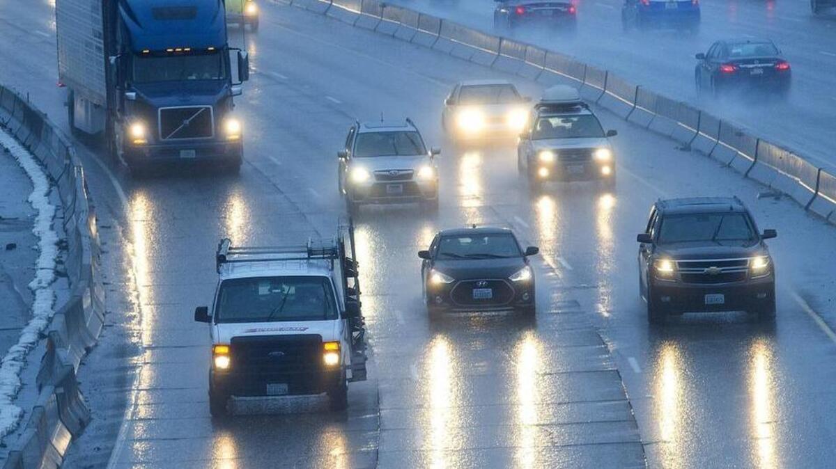 Headlights reflect off the wet pavement during the March 15, 2017 morning commute northbound on Interstate 5 in Tacoma.