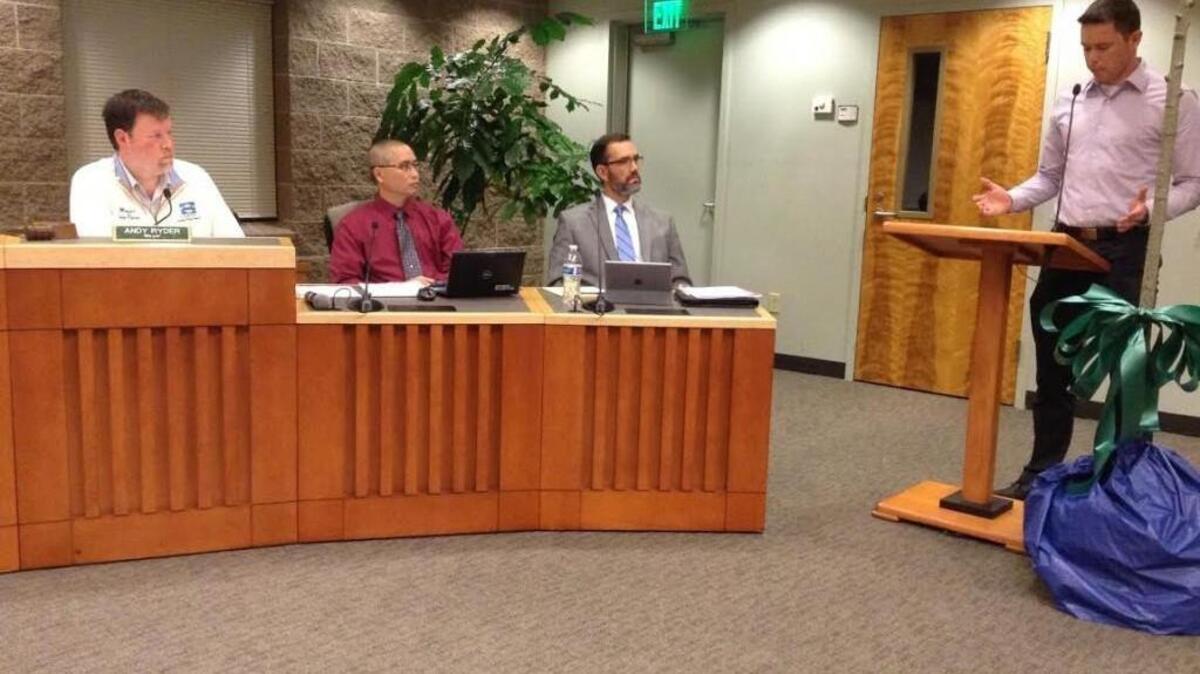 Lacey resident and avid cyclist Vaughn Nelson (far right) testifies in support of bike lanes on College Street Southeast during Thursday night’s Lacey City Council meeting.