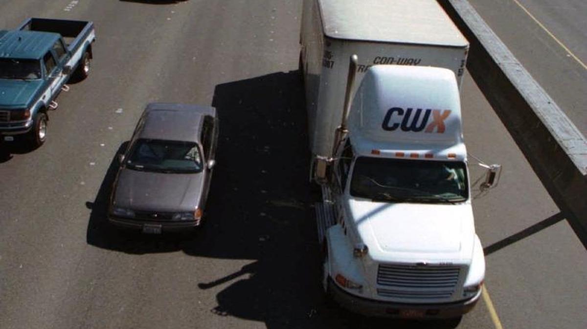 Lane camping, like what this semitruck at the right is doing on Interstate 5 in Olympia back in 1997, is illegal. Washington State Patrol troopers will be performing a lane camping emphasis next week.