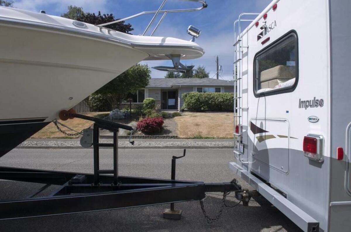 Residents on a stretch of North Woodlawn Street in Tacoma claim a neighbor continuously parks his large RV and boat on the street, making it difficult for some vehicles to pass. They claim he regularly moves the vehicles slightly to avoid parking restrictions.