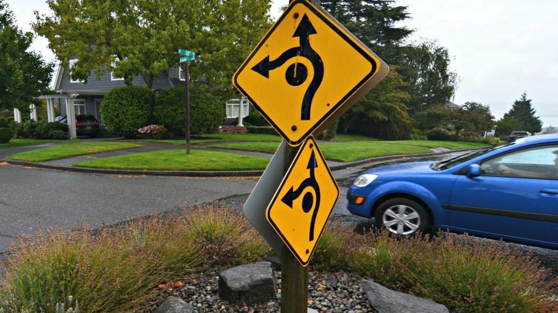 A driver navigates the traffic-calming circle at North 28th and North Cedar streets in Tacoma.