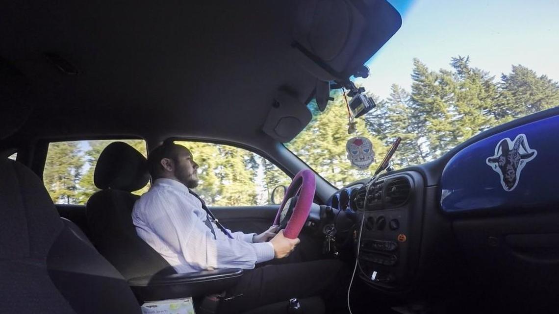 Davis LaMuerta listens to music as he commutes along I-5 from his house in Vancouver, Wash., to his job in Tumwater on Thursday, June 22, 2017. LaMuerta travels more than 100 miles a day to get to work. He uses music, audiobooks and podcasts to keep himself entertained and engaged during the long drives.