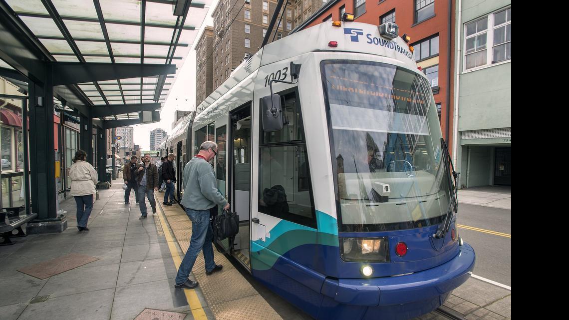 
A Link light rail car picks up passengers at the Theater District station on Commerce Street, the end-of-the-line for the existing system. 
