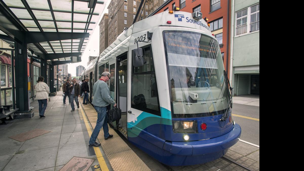 
A Link light rail car picks up passengers at the Theater District station on Commerce Street, the end-of-the-line for the existing system. 
