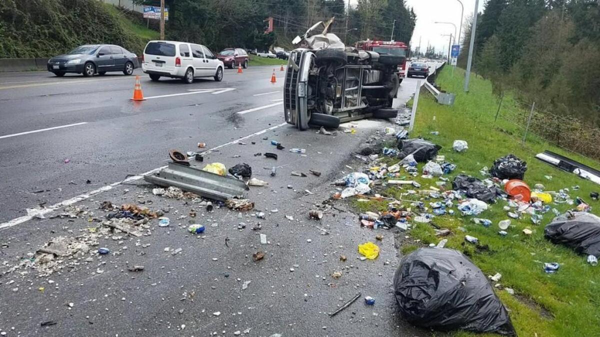 A rolled-over truck sits on the side of state Route 410 in Bonney Lake after a Thursday afternoon crash.