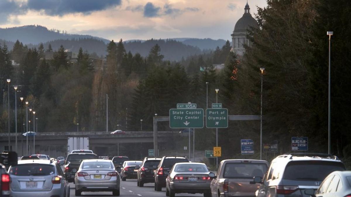 Southbound traffic on Interstate 5 slows at the beginning of the evening rush hour in OIympia on Nov. 17. The state will soon test ways of charging drivers for miles traveled instead of gallons of gasoline burned.