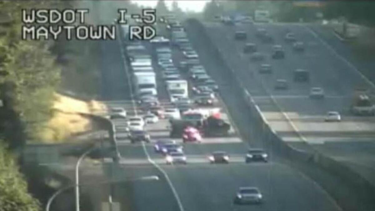 A photo from a traffic camera shows a wreck Sunday evening between Olympia and Centralia that closed all lanes of northbound Interstate 5.