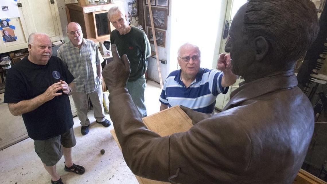 In his Key Peninsula workshop , sculptor Paul Michaels, second from left, listens to Local 23 longshoremen Jim Norton, left, Bill Connolly, center, and Ronald Magden, right, on what they’d like to see changed in the clay statue of Harry Bridges.