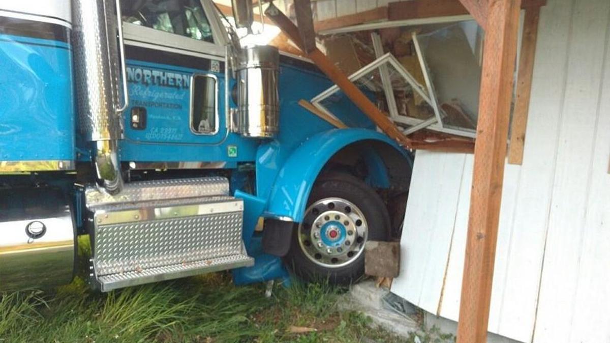 A semitruck plowed into this Roy home Sunday after the driver suffered a medical emergency.