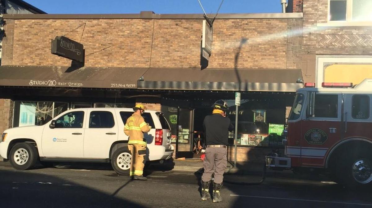 Firefighters respond to Friday morning’s fire at the Forum Pub in downtown Puyallup.
