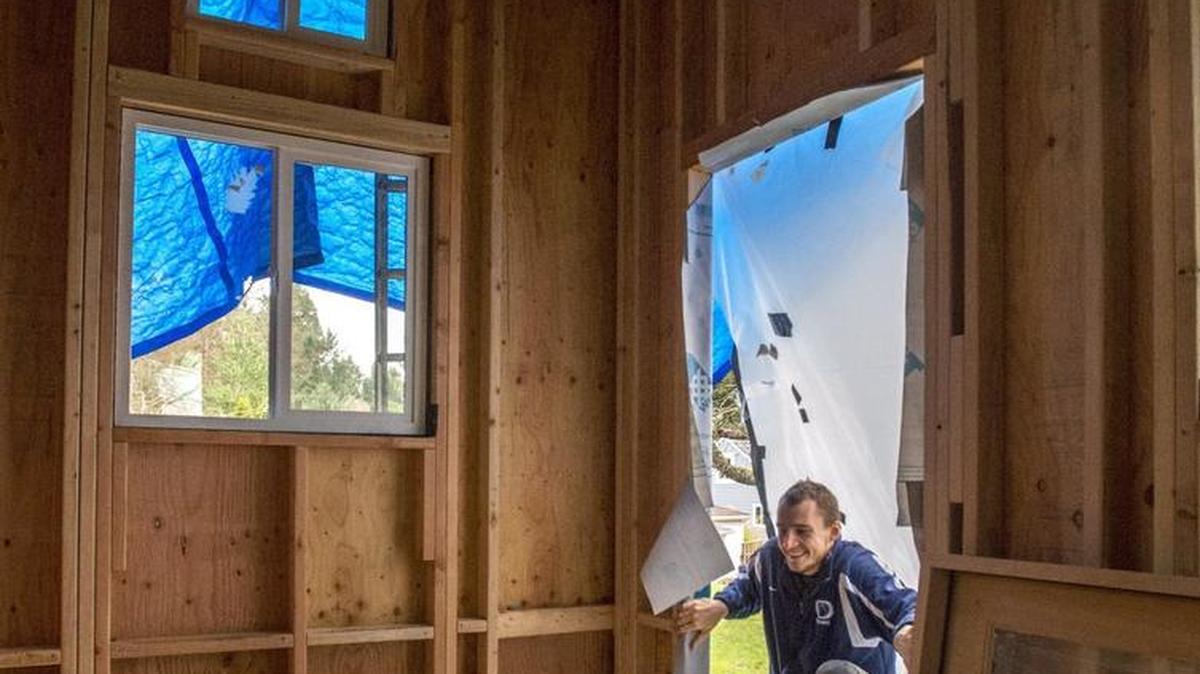 Alex Weber-Brader, a former high school and college basketball player, is happy to have high ceilings in the tiny house he is building in Northeast Olympia, December 22.