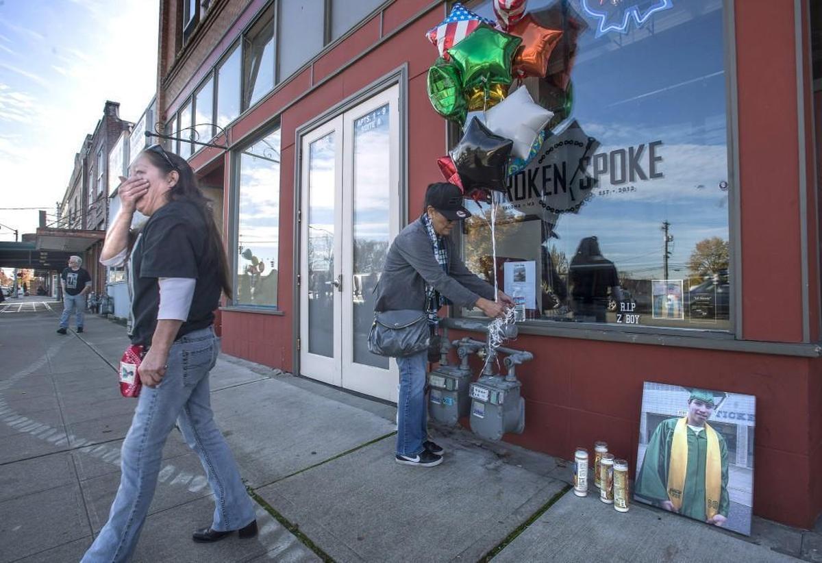 Kim Nystrom, the mother of Steven Speakman weeps after setting candles near a picture of her son during a remembrance and celebration of life ceremony Thursday, one year after Speakman, a beloved neighbor of the Hilltop community was mysteriously gunned down in front of the Broken Spoke on Martin Luther King Way early last November. Tacoma Police have yet to solve the case and friends and family say they are determined to keep Steven’s memory alive and find the murderer.