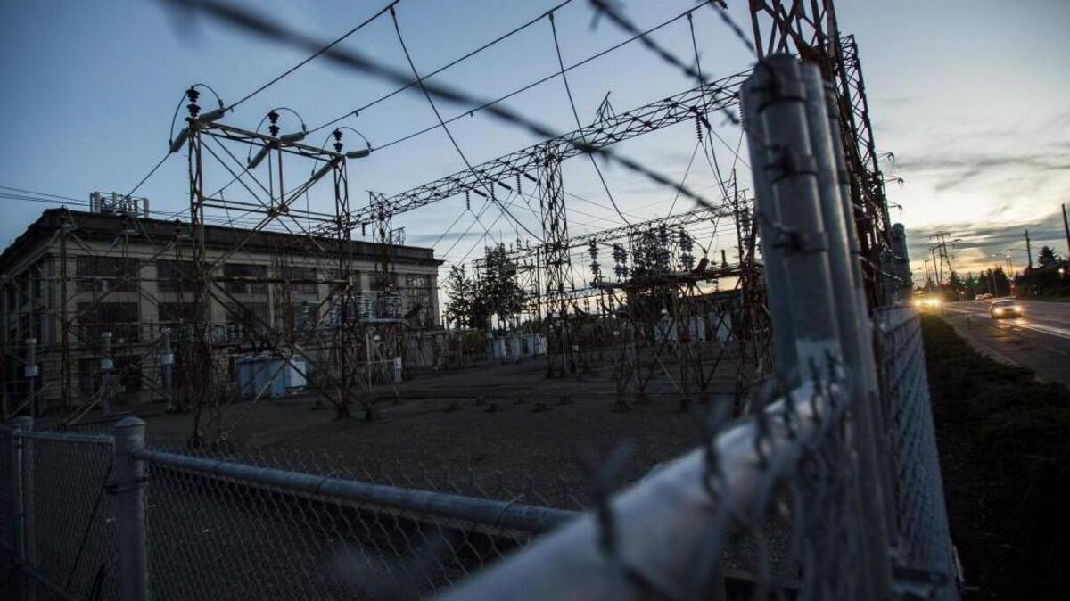 Cars drive by the Cushman Substation in Tacoma in 2017. The city of Tacoma is still planning what the historic Cushman and Adams substations should become in the future.