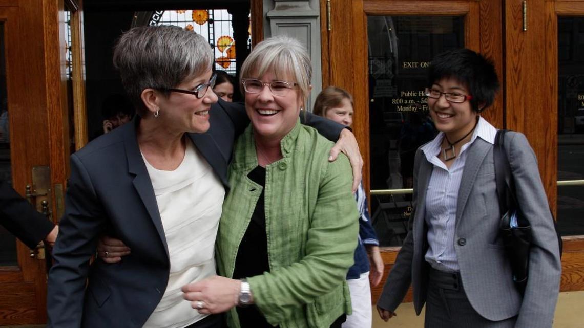 Margaret Witt, center, and her partner, Laurie McChesney, left, celebrate with Sher Kung, right, an attorney with the ACLU, as they leave the federal courthouse in Tacoma in 2010 after a federal judge ruled that Witt should be given her job in the Air Force back.