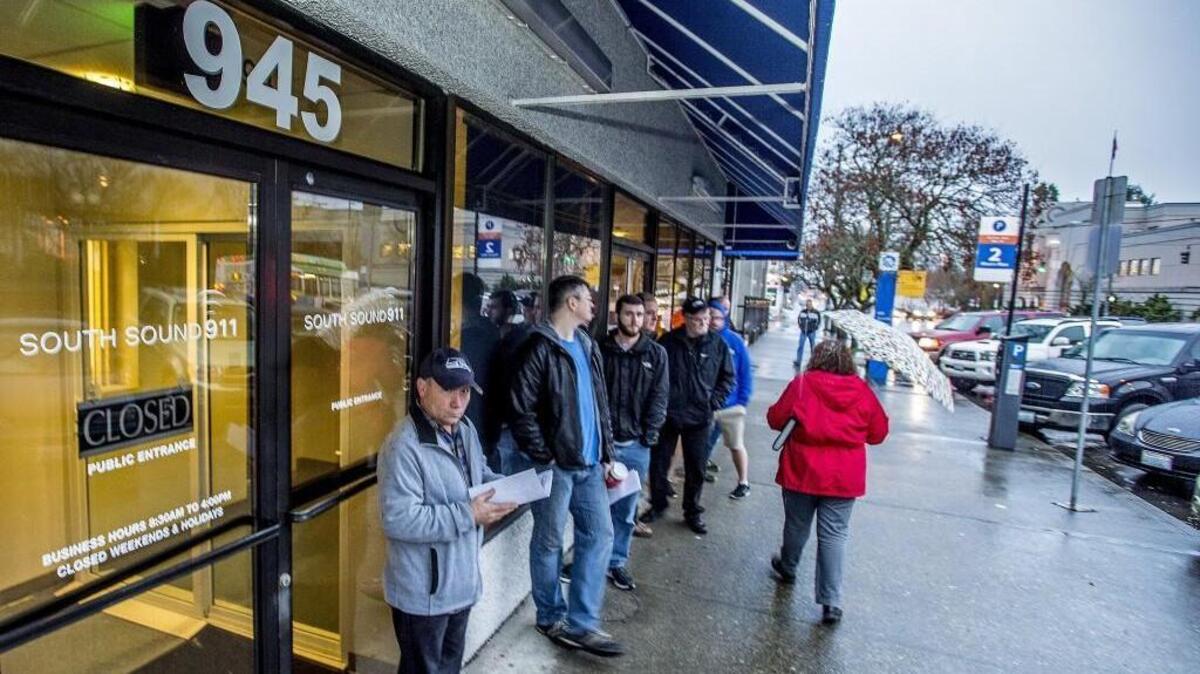 A line forms Monday outside the doors of South Sound 911 offices on Tacoma Avenue. People started lining up almost an hour before the agency opened. State concealed pistol licenses are issued for the lion’s share of Pierce County residents from the offices. Officials say they’ve seen a recent increase in applications for the permits and do not expect that trend to slow.