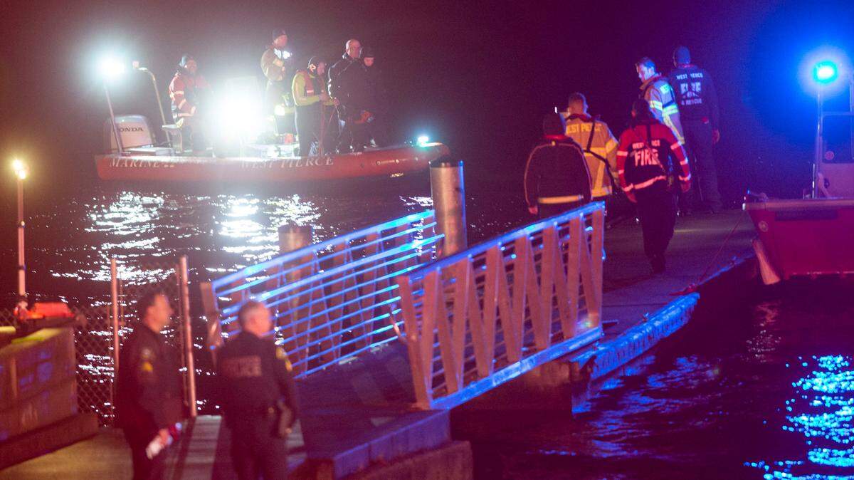 Members of the West Pierce Fire and Rescue along with officers from the Lakewood Police Department congregate near the boat launch at American Lake Park on the north end of American Lake in Lakewood on Saturday night. Earlier in the evening, West Pierce Fire and Rescue tweeted that they were conducting a water rescue and searching for a missing boater. No one on the scene as able to comment on the progress of the rescue or search.