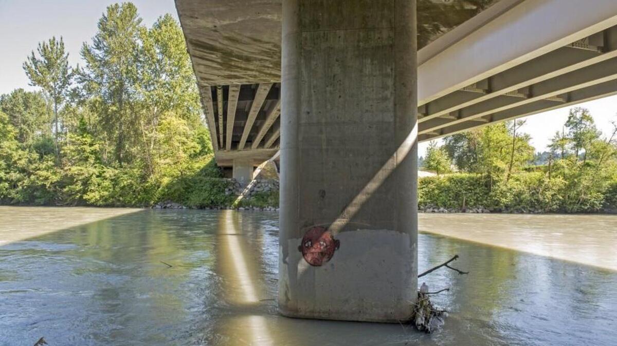 The Puyallup River flows under the two spans of the N. Meridian Avenue bridge. A 16-year-old boy who died early Thursday after jumping the rail has been identified as Jordon Gish.