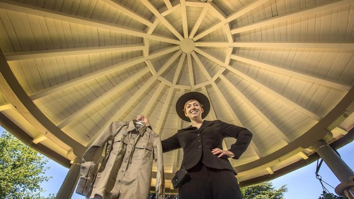 Mary Krauszer, a 25-year-old University of Puget Sound alumna, will trade in a pant suit for khakis and a hat as the first park ranger for Point Defiance Park. Krauszer, an Alaska native and avid roller derby player, graduated from UPS in 2012 with a biology degree. She stands outside the Visitors Center at Point Defiance Park on Friday with her new ranger uniform in hand.