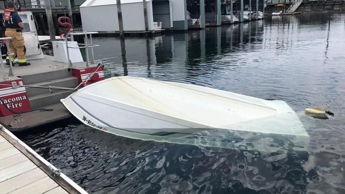 A capsized aluminum boat sits in Narrows Marina after being towed there Wednesday afternoon by Destiny, the Tacoma Fire Department rescue boat. The sole occupant of the boat was able to safely swim to shore.