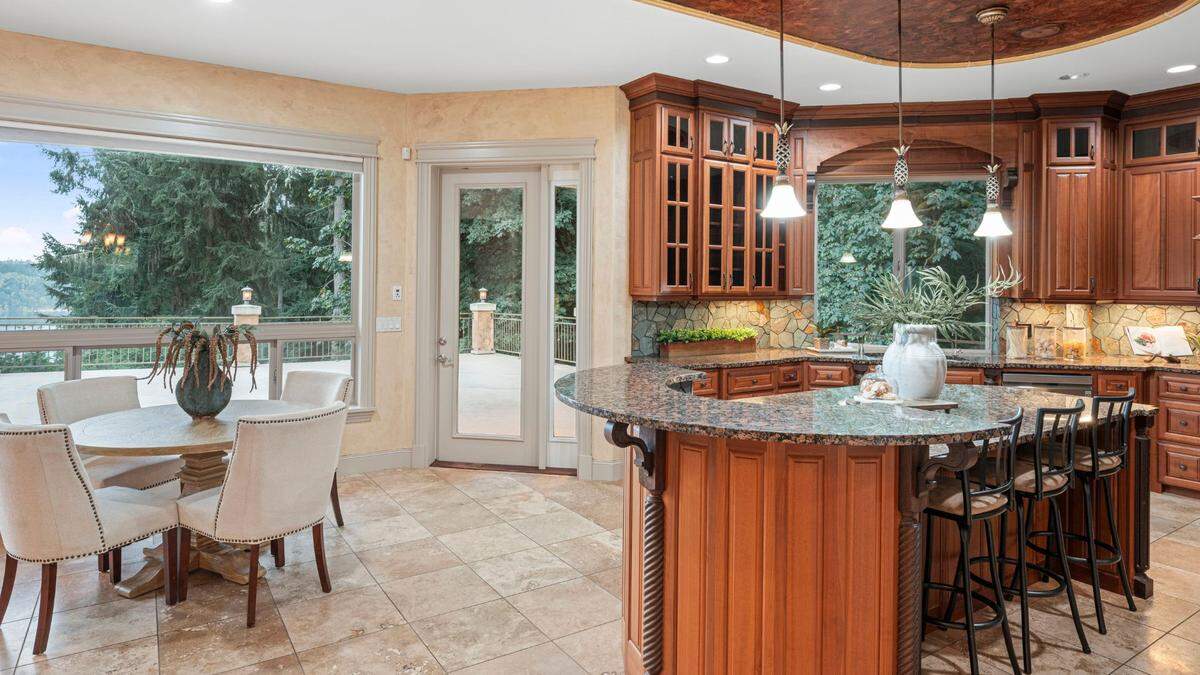 The home includes a chef’s kitchen with walk-in pantry, plus a second full kitchen downstairs, per the listing.