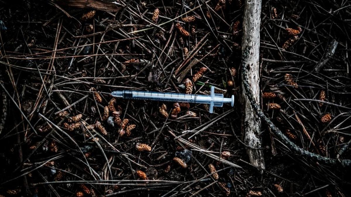 A used needle and syringe behind the public library in Eureka, Calif., March 20, 2018. Syringe litter can also be found scattered on the forest floor around the city, the detritus of a growing heroin scourge gripping the remote community and a significant flash point for middle-class residents who understand the importance of tourism to the region.